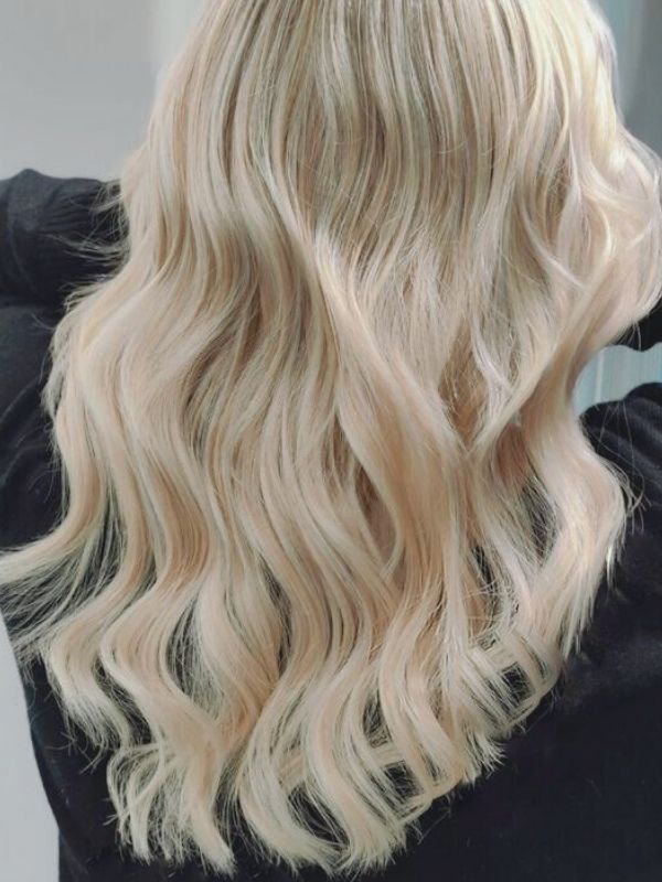 Tape-in extensions – naturally voluminous and glossy hair perfected by Niki Newd® Hair Studio.