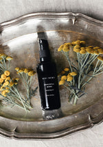 Niki Newd® Graceful Mama nourishing oil in a glass bottle – a fresh antioxidant-rich face and body oil handcrafted in Finland.