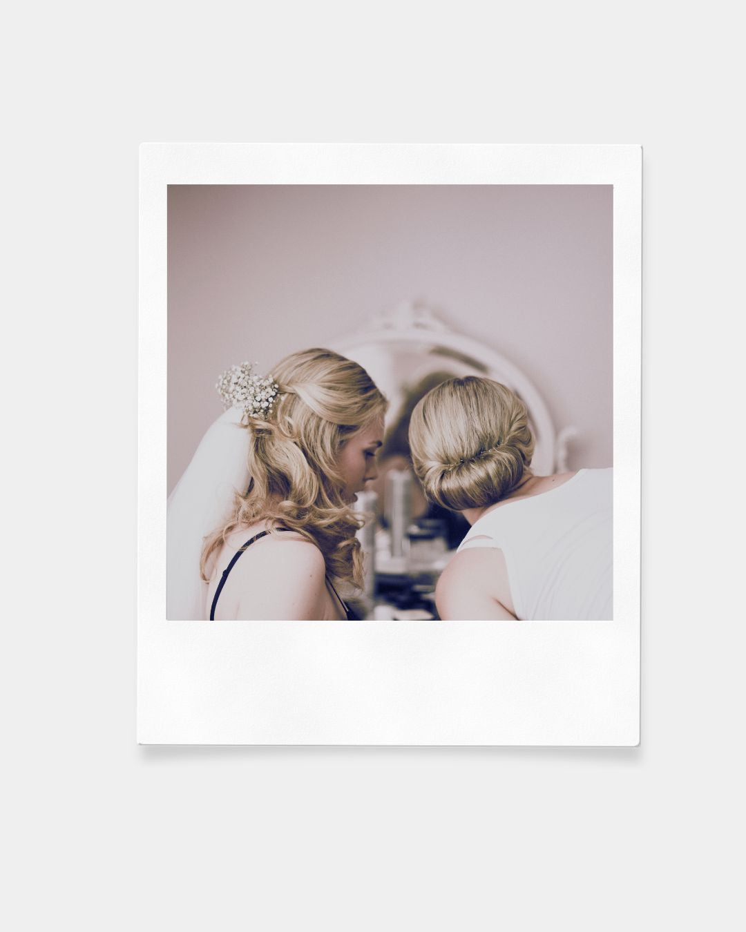 Bride's hairstyle and bridesmaid's elegant donut bun updo. Hair and makeup by Niki Newd Studio.