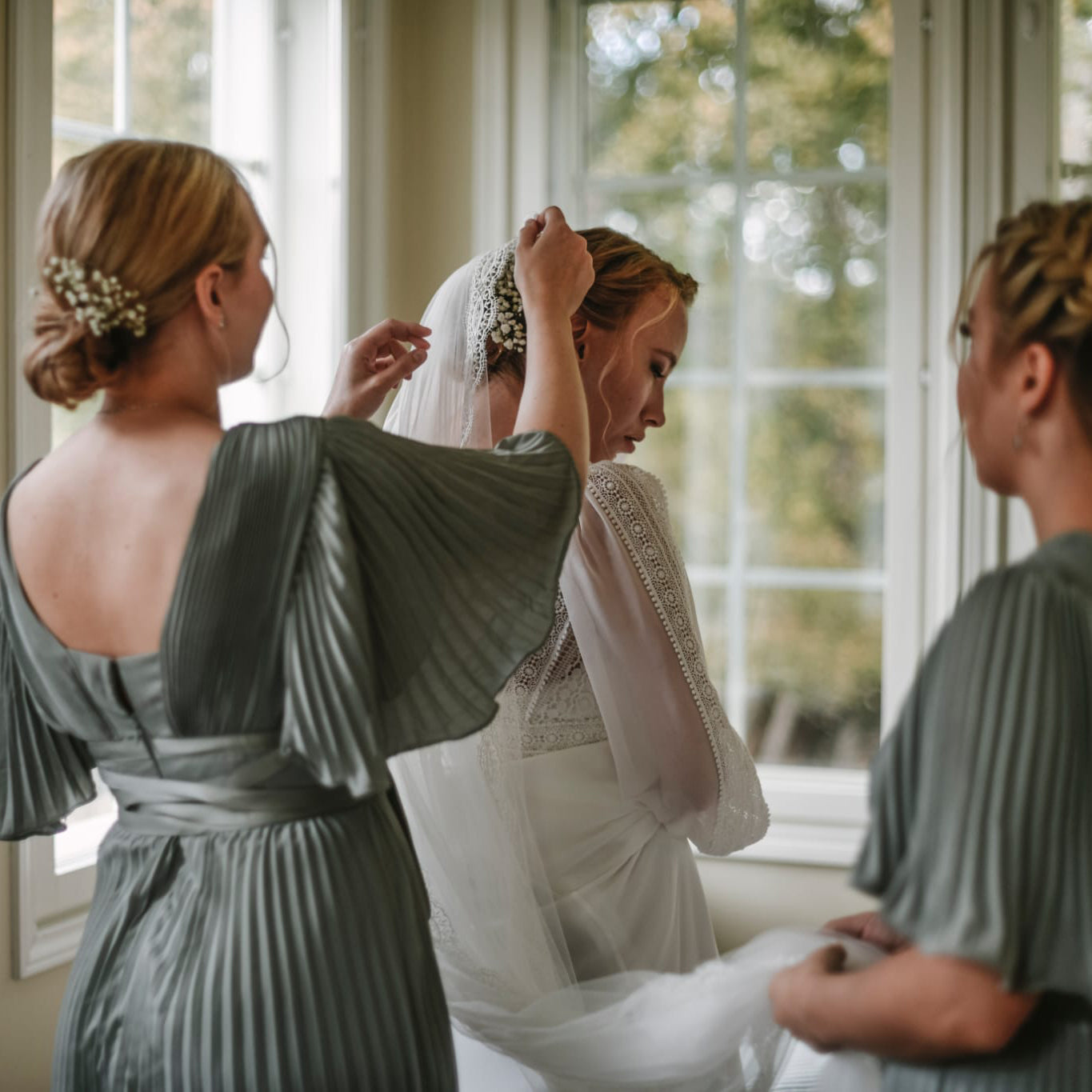 Refined bridal look with a side bun and warm-toned makeup highlights. Make up & Hari by Niki Newd Studio.